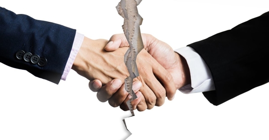 Two people shaking hands and split