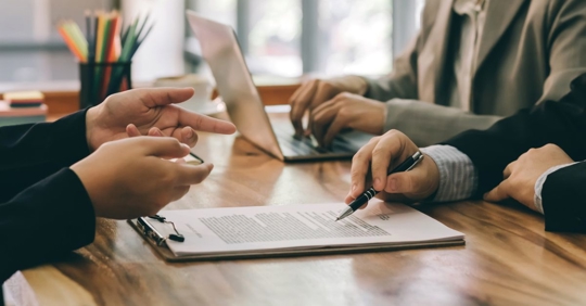 people discussing contracts